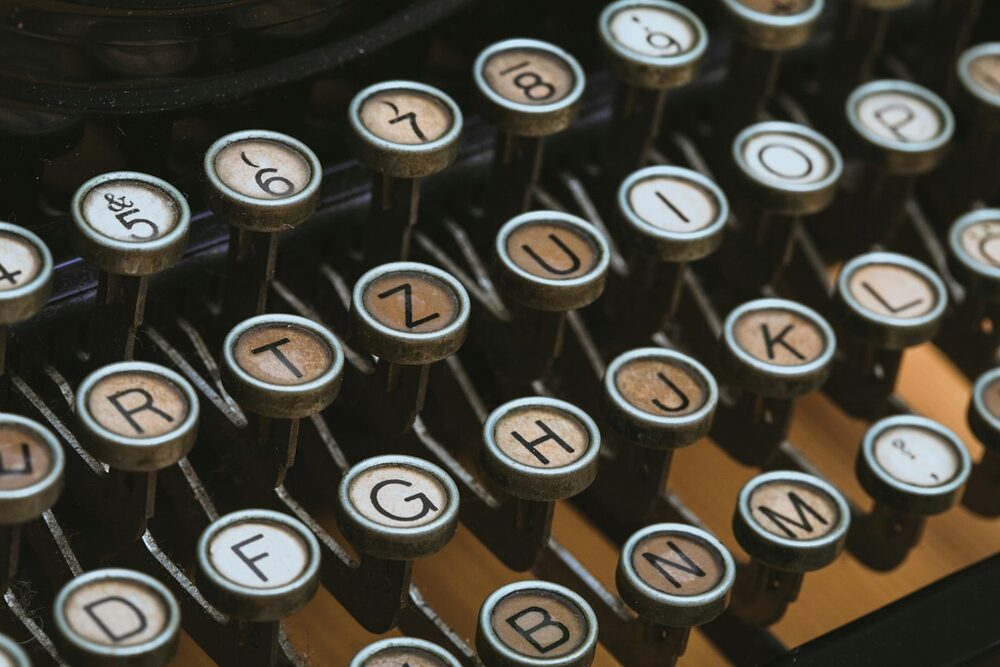 Stand-up comedy news at D.O.C.: old typewriter keys in amber light