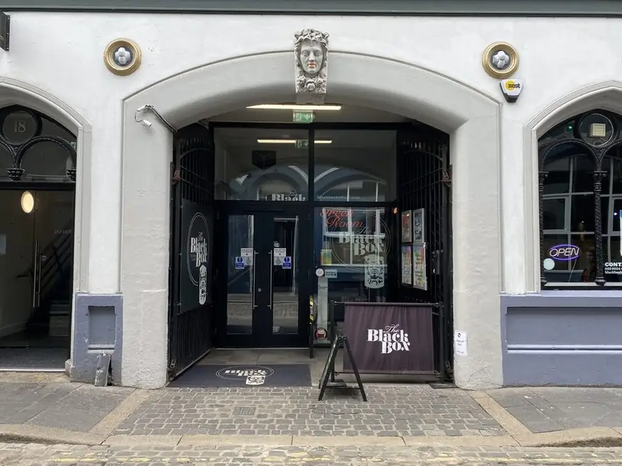 The Black Box in Belfast: a white arched entrance on Hill Street with The Black Box signs.